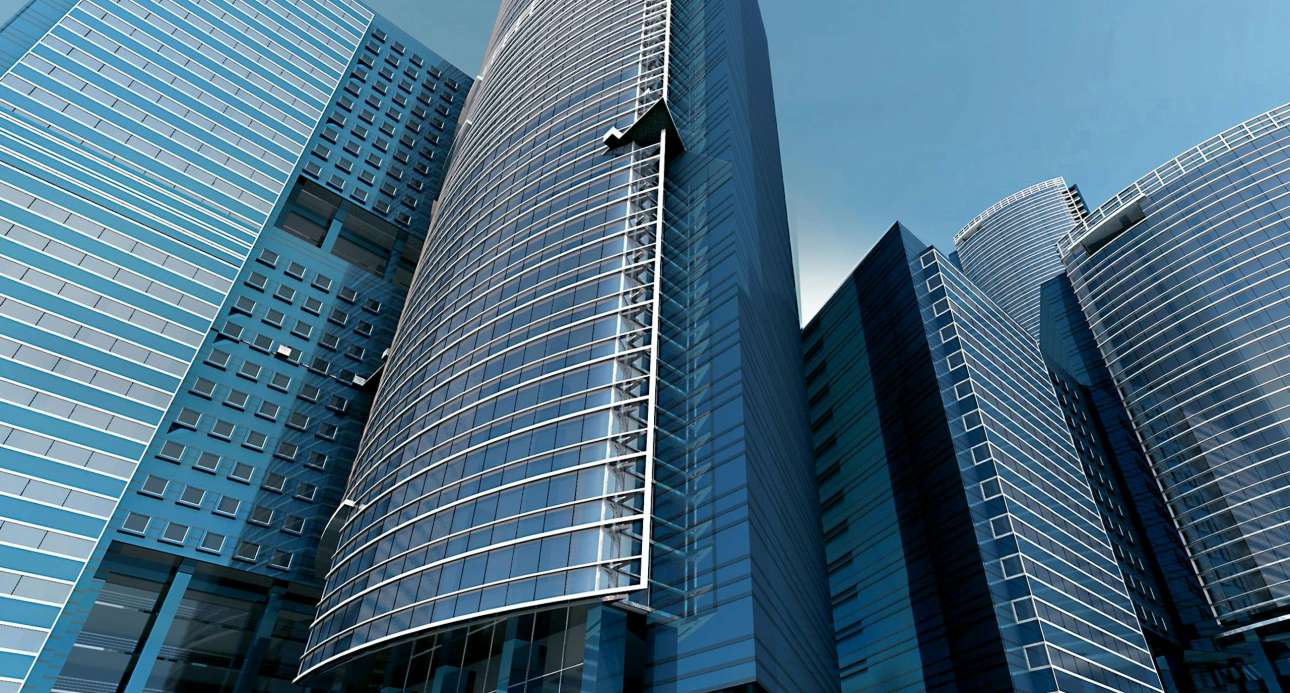 Futuristic urban skyscrapers with glass facades reflecting a vibrant blue sky.